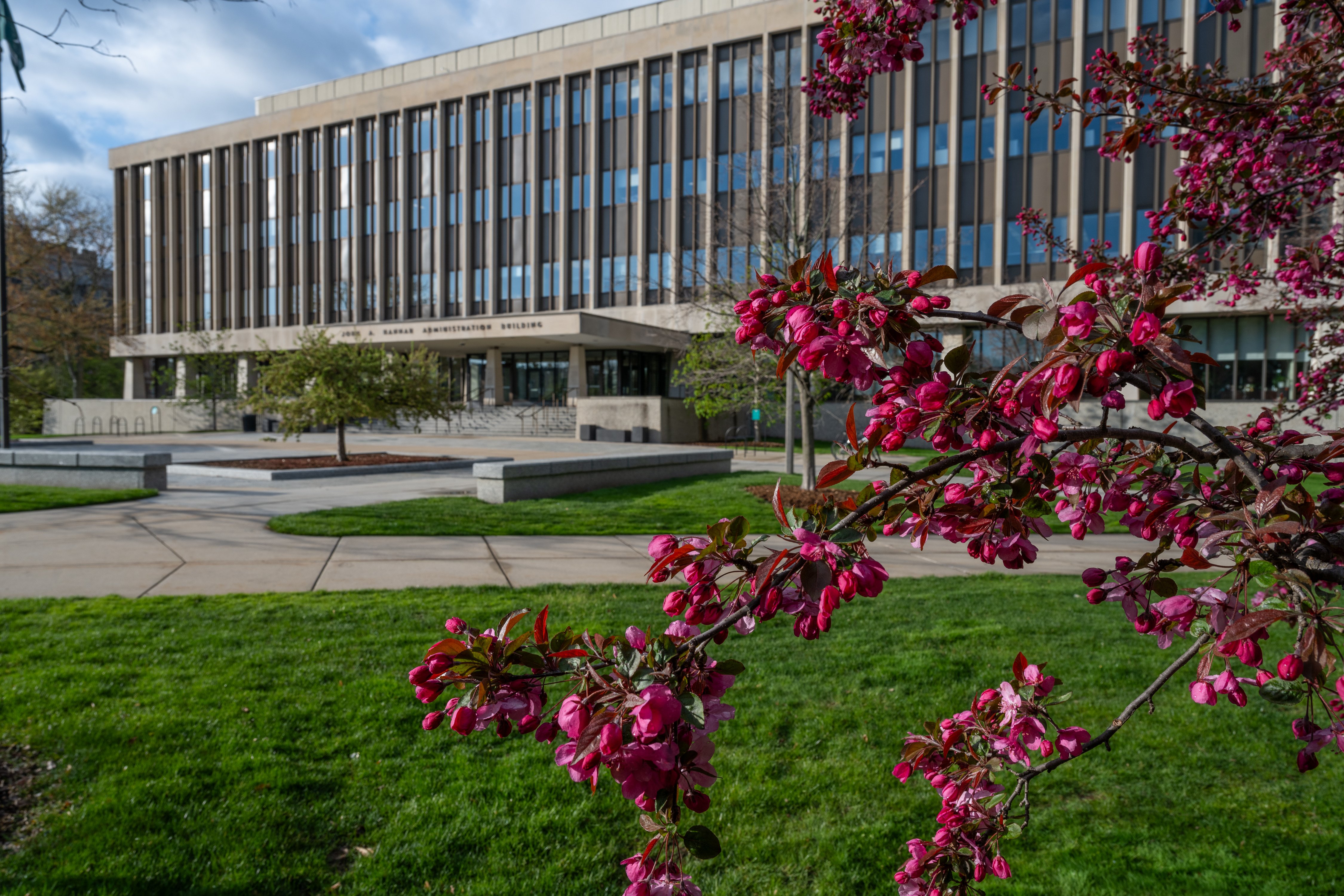 Hannah Administration Building on a sunny day surrounded by green 