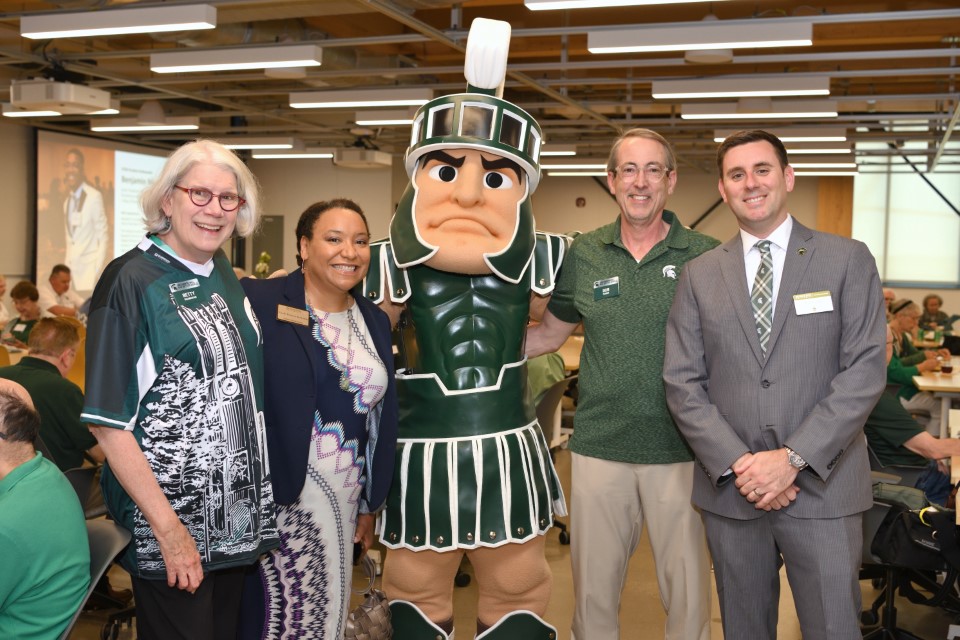 Betty Shanahan and Bob Nuber paused for a photo with Sparty, along with Nicole Proctor-Kanyama from the College of Engineering and Sean Lynch from the Office of Gift Planning.