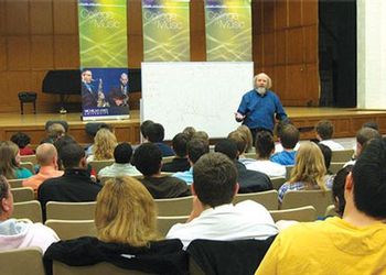 John Kratus presents to an auditorium filled with music education students John Kratus presents to an auditorium filled with music education students