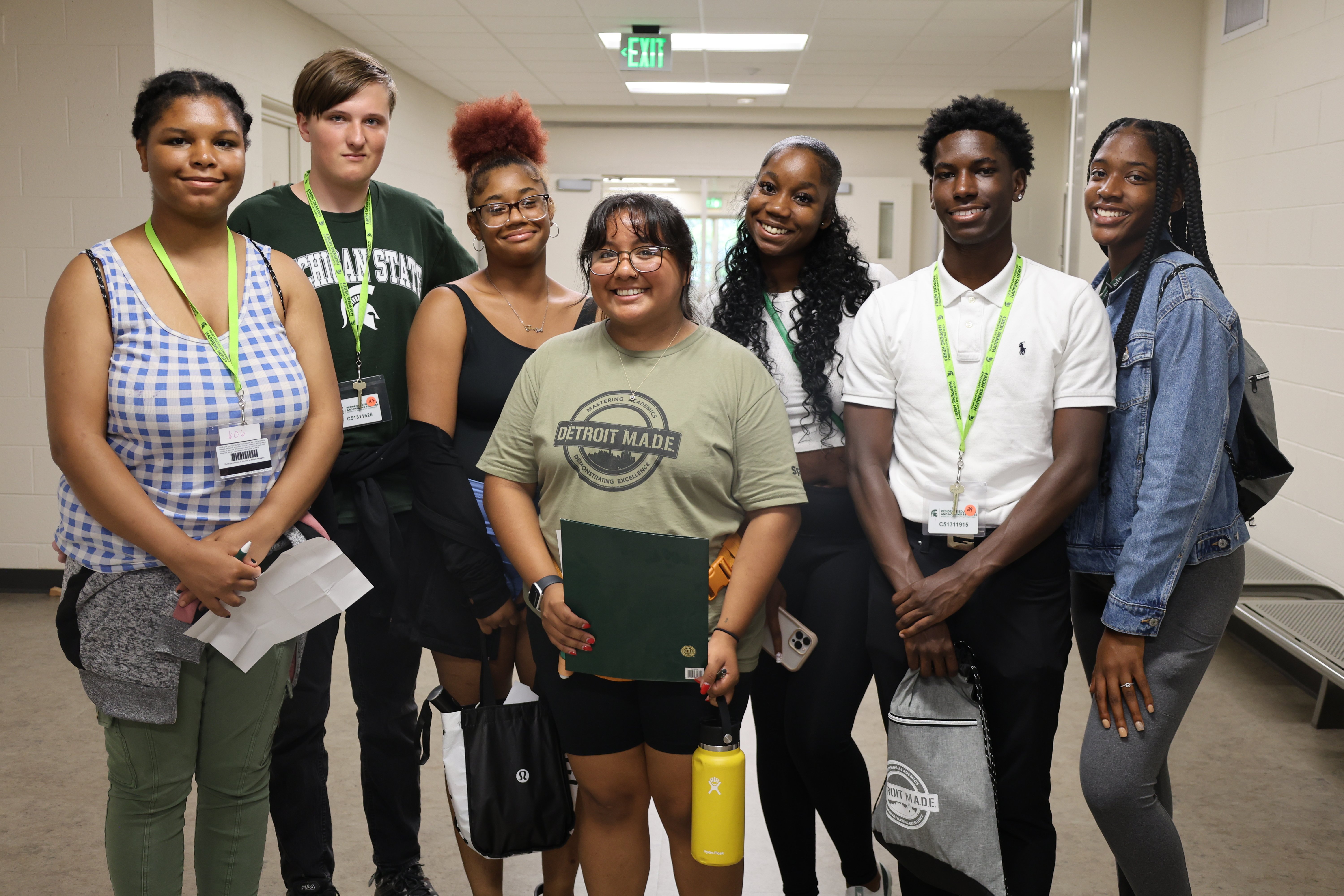Group of Detroit M.A.D.E. students gathered together smiling and looking at the camera.