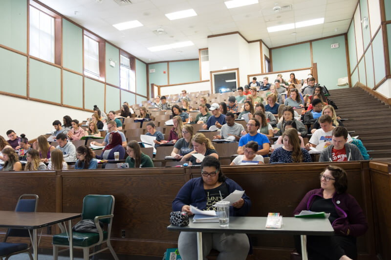 Students sit in a lecture hall during a class at Michigan State University.