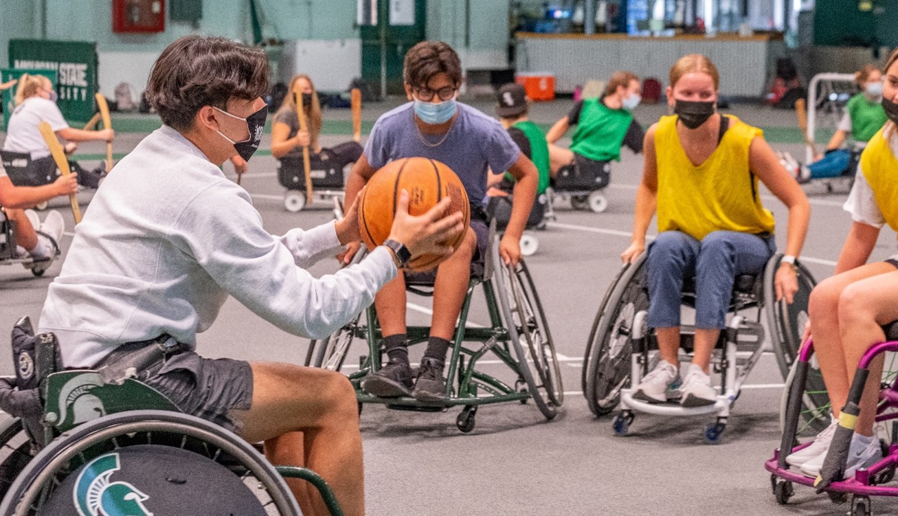 Michigan State University students play wheelchair basketball at the East Lansing campus.