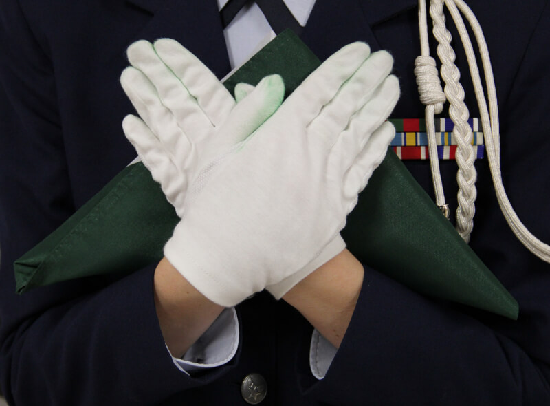 U.S. Air Force ROTC cadets folding Spartan flags