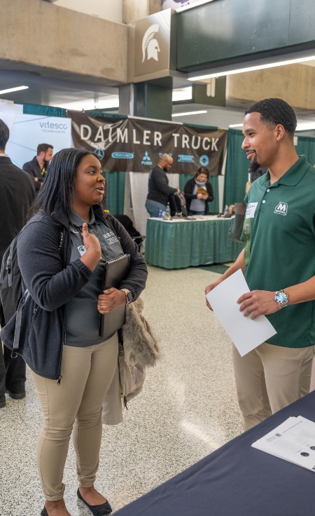 A first generation student at an MSU career fair