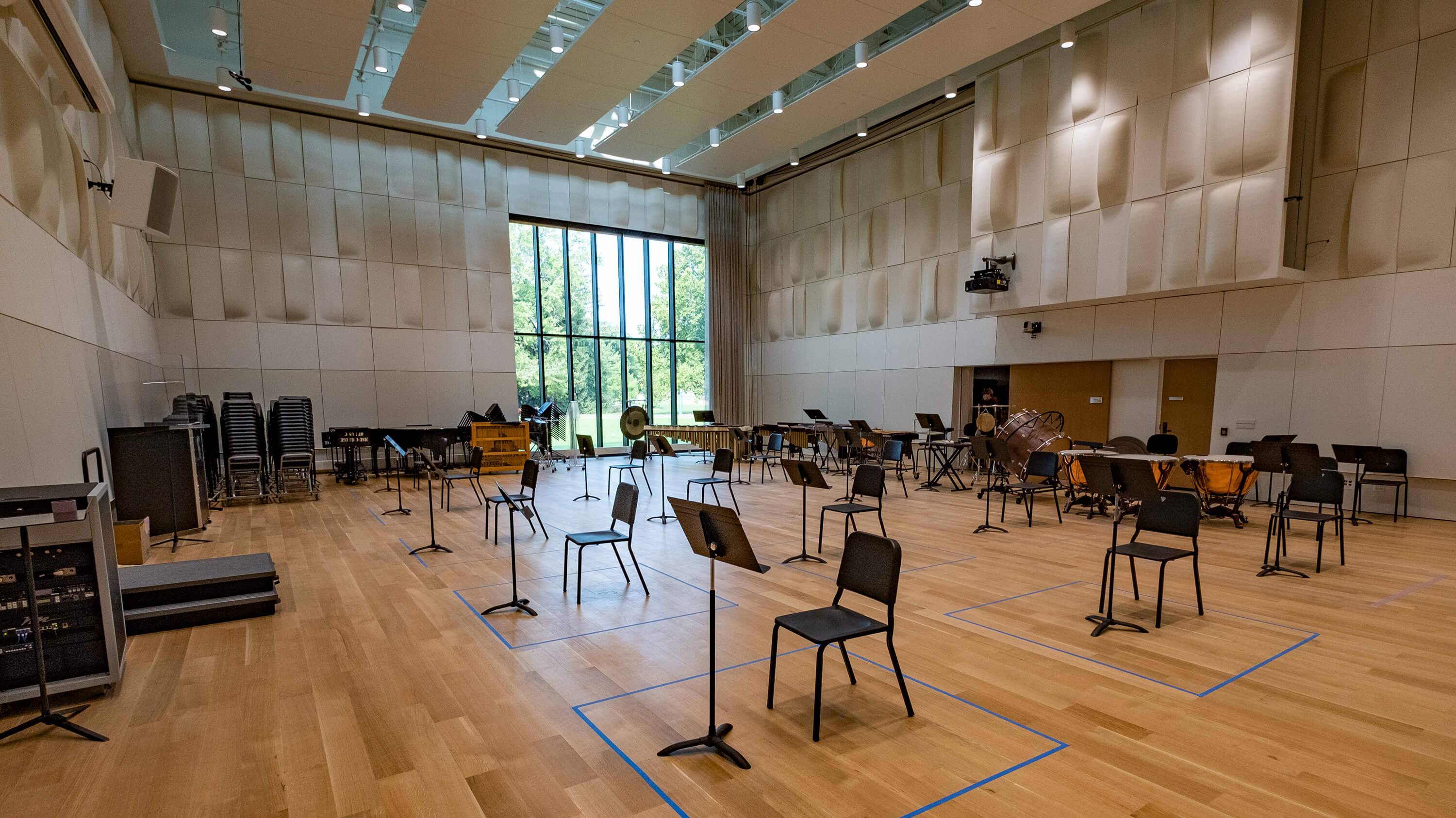 A music performance space in the MSU music building, shown empty but set up with chairs and music stands.