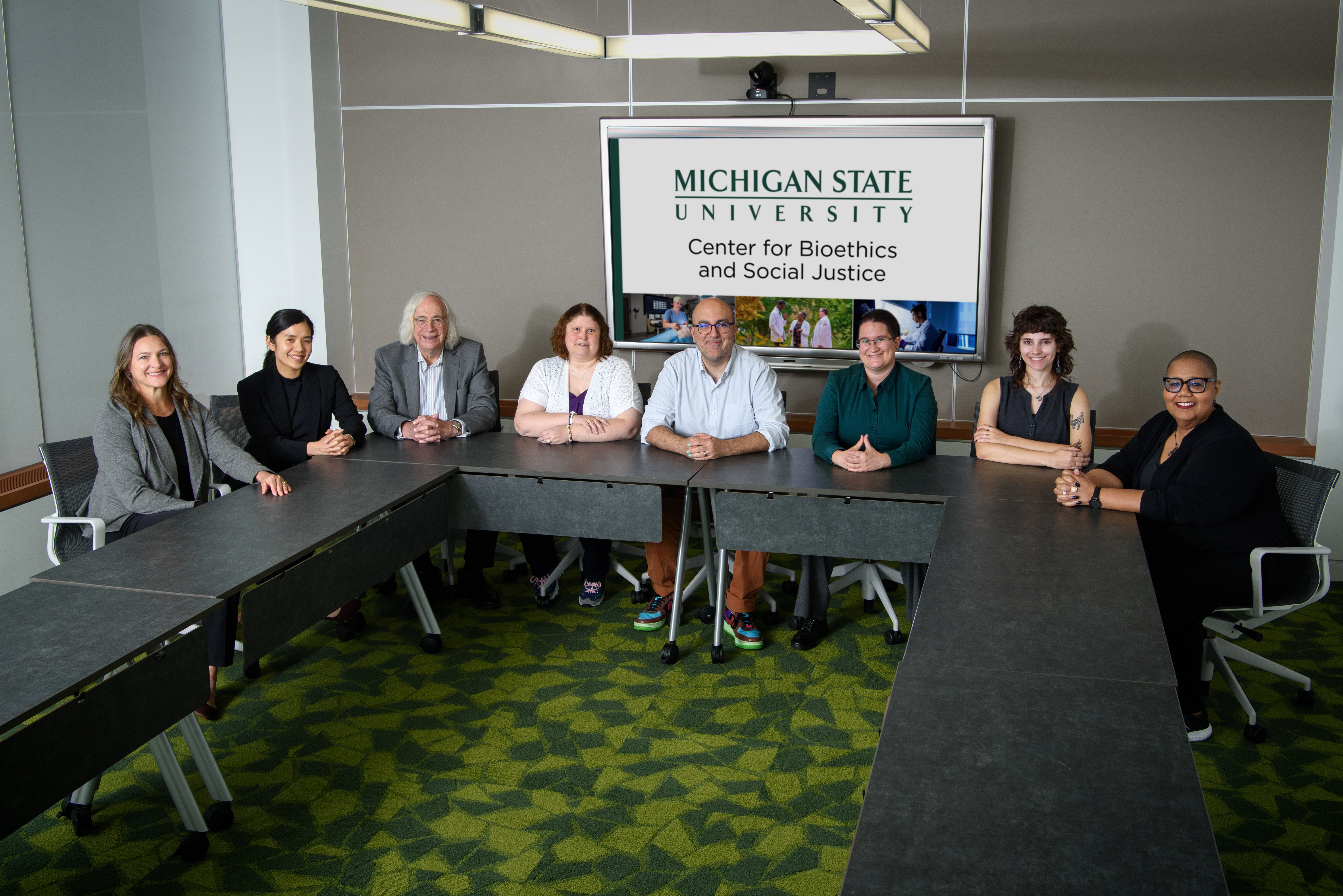 BSJ faculty sitting at table