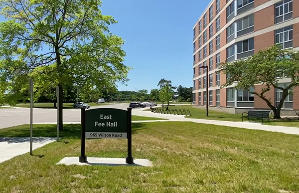 A photo of a sign in front of Fee Hall