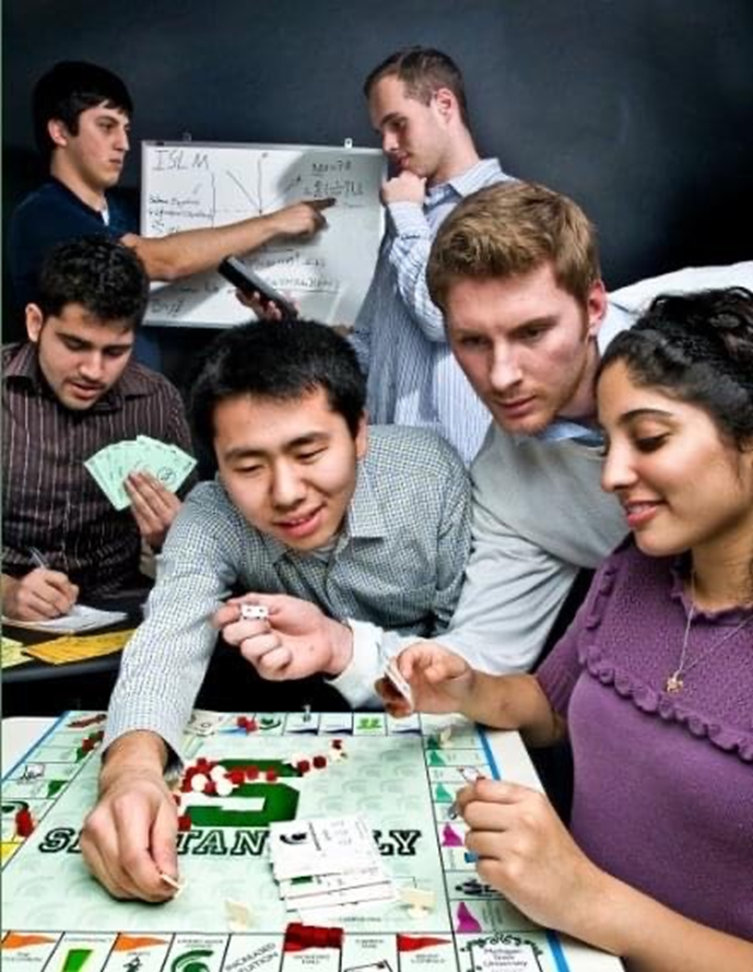 College Fed Challange students create graphs and play monopoly.