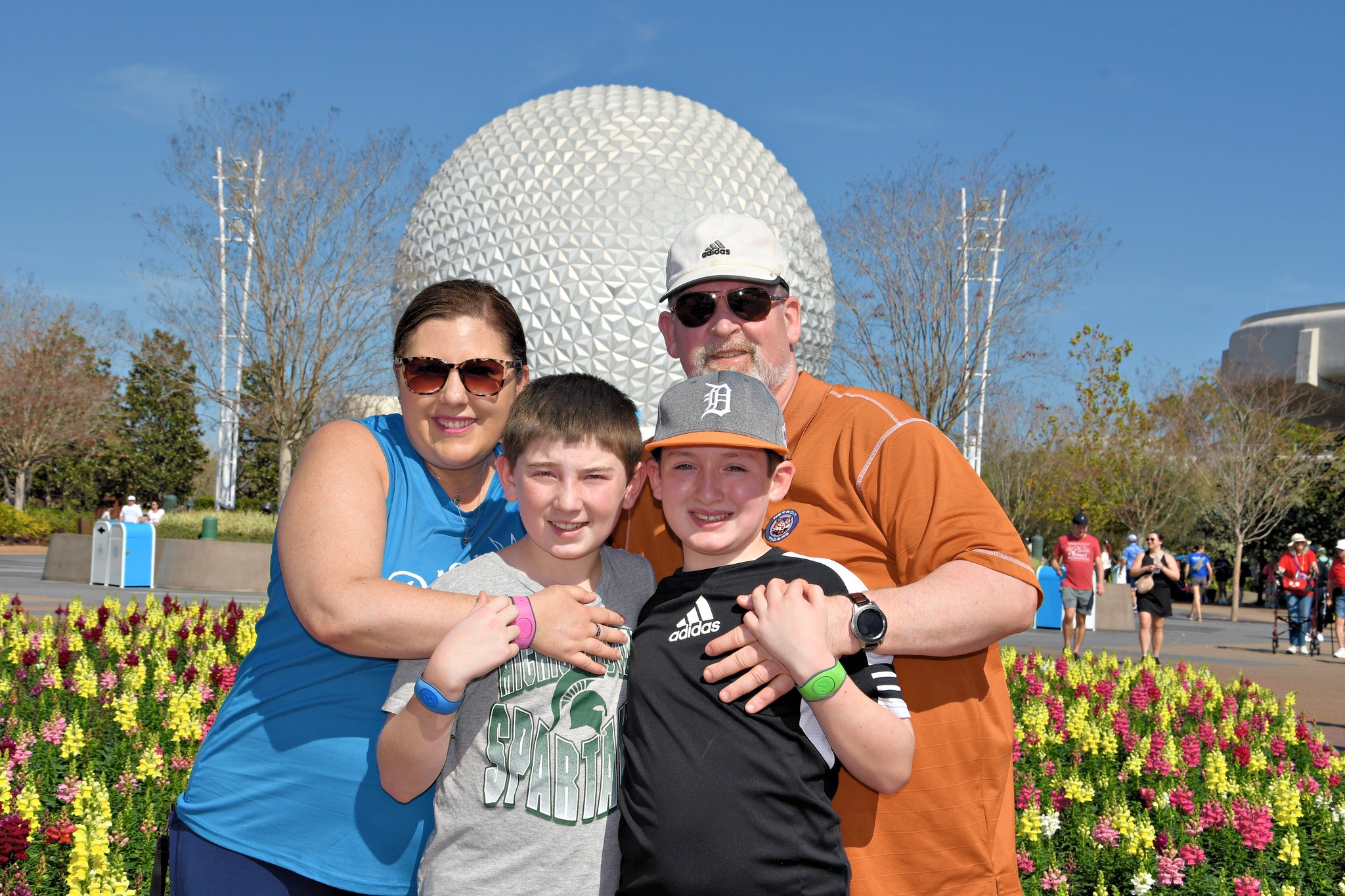 Two parents and their children with Epcot in the background.