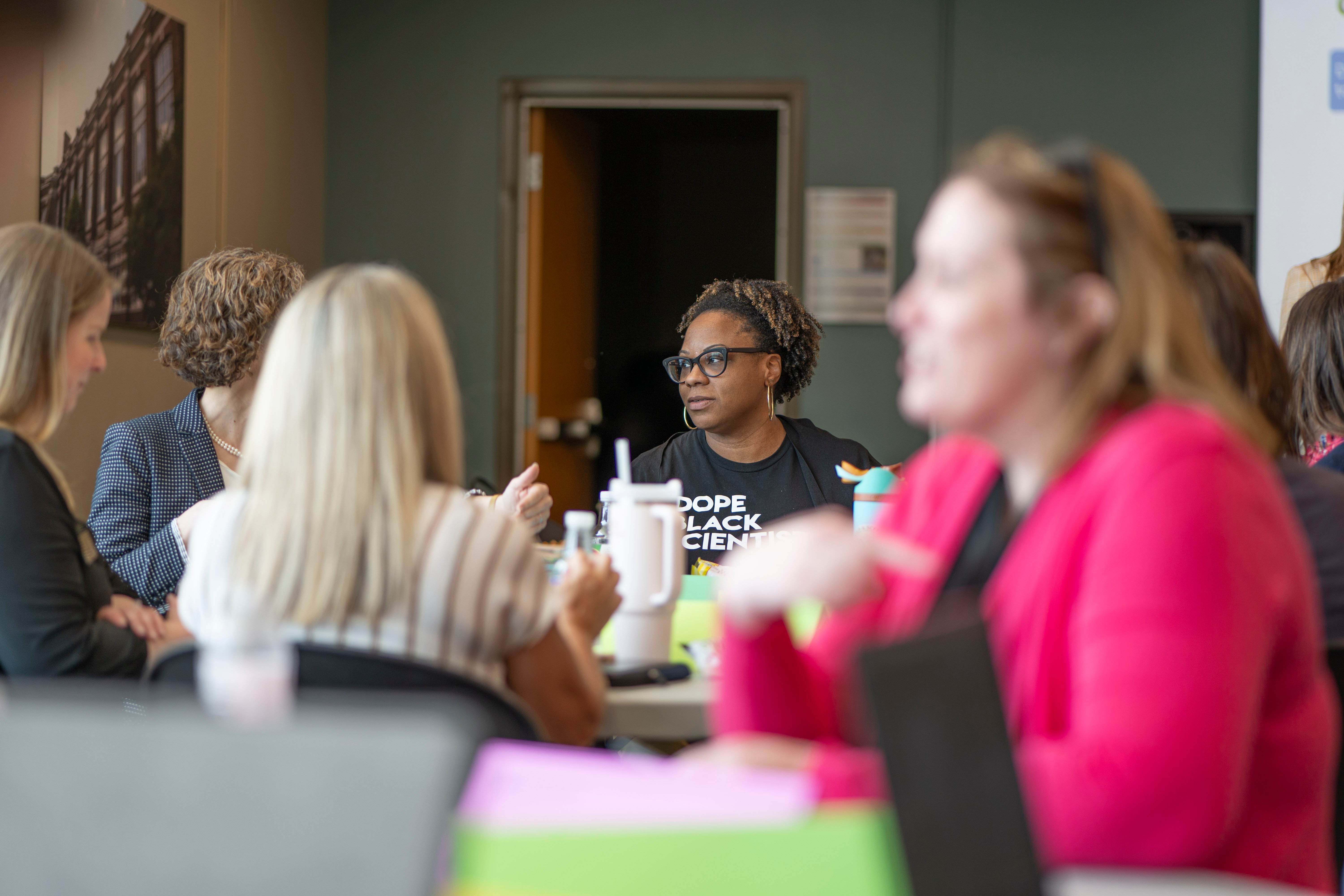 Stefanie Marshall listens during a meeting.