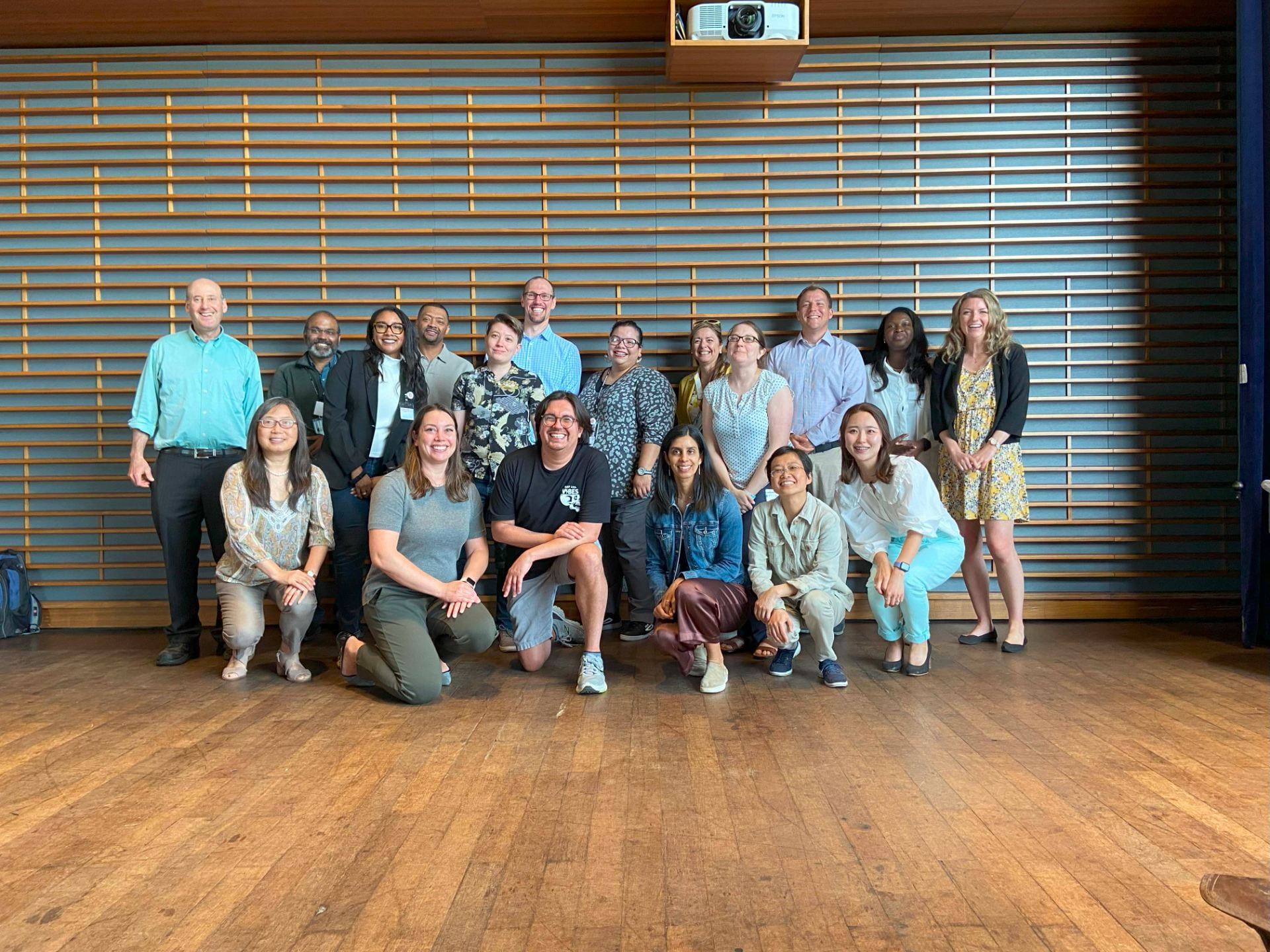 Ken Frank poses with a group of students during a group training