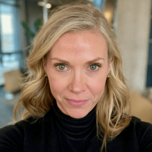 Porsche Fischer wearing a dark sweater.