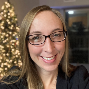 Jessica Garrels wearing a black shirt and glasses