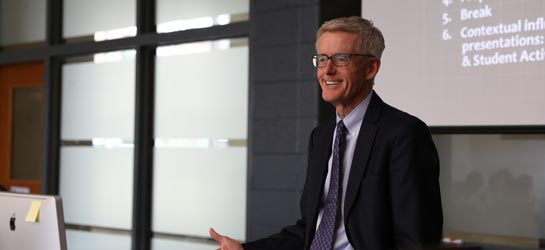 Roger Baldwin leads a class