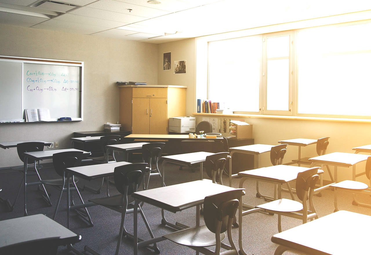 Empty classroom with sunlight filtering in