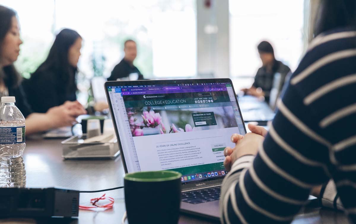 Close-up of an open and active laptop exploring an MSU website during a rehabilitation counseling meeting.
