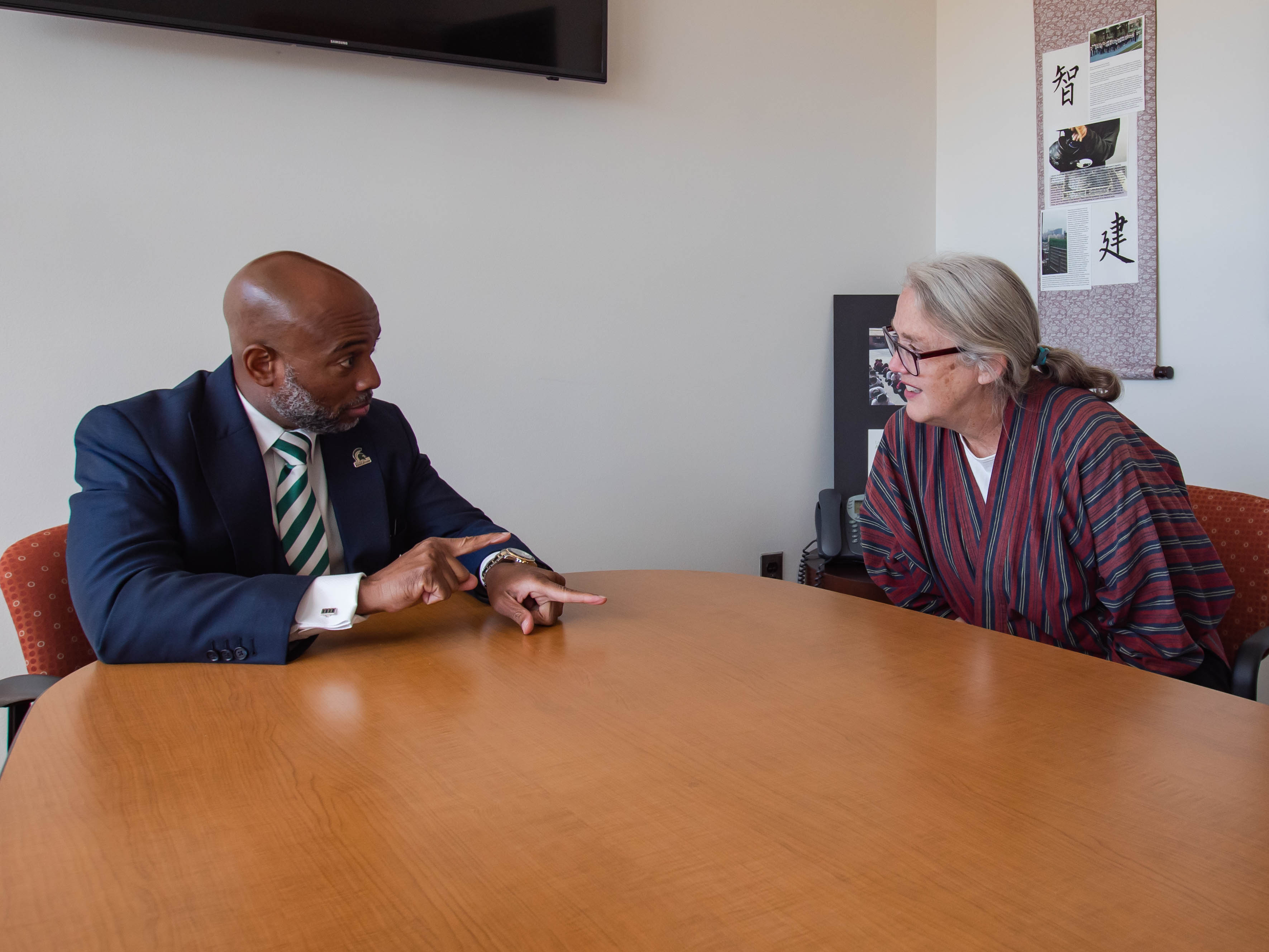 Jackson and Paine during a meeting