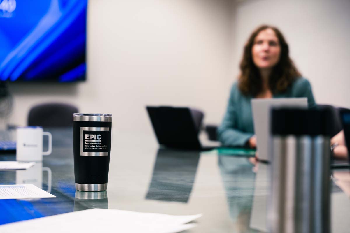 Close-up on a black coffee tumbler with the words: