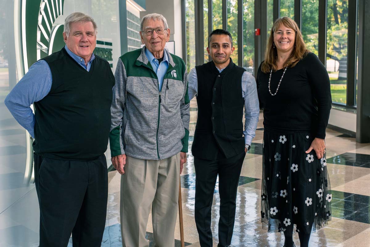 Group photo of: Prof. Emeritus Daniel Gould, Prof. Emeritus Vern Seefeldt, guest speaker Avinash Chandran and Professor Karin A. Pfeiffer