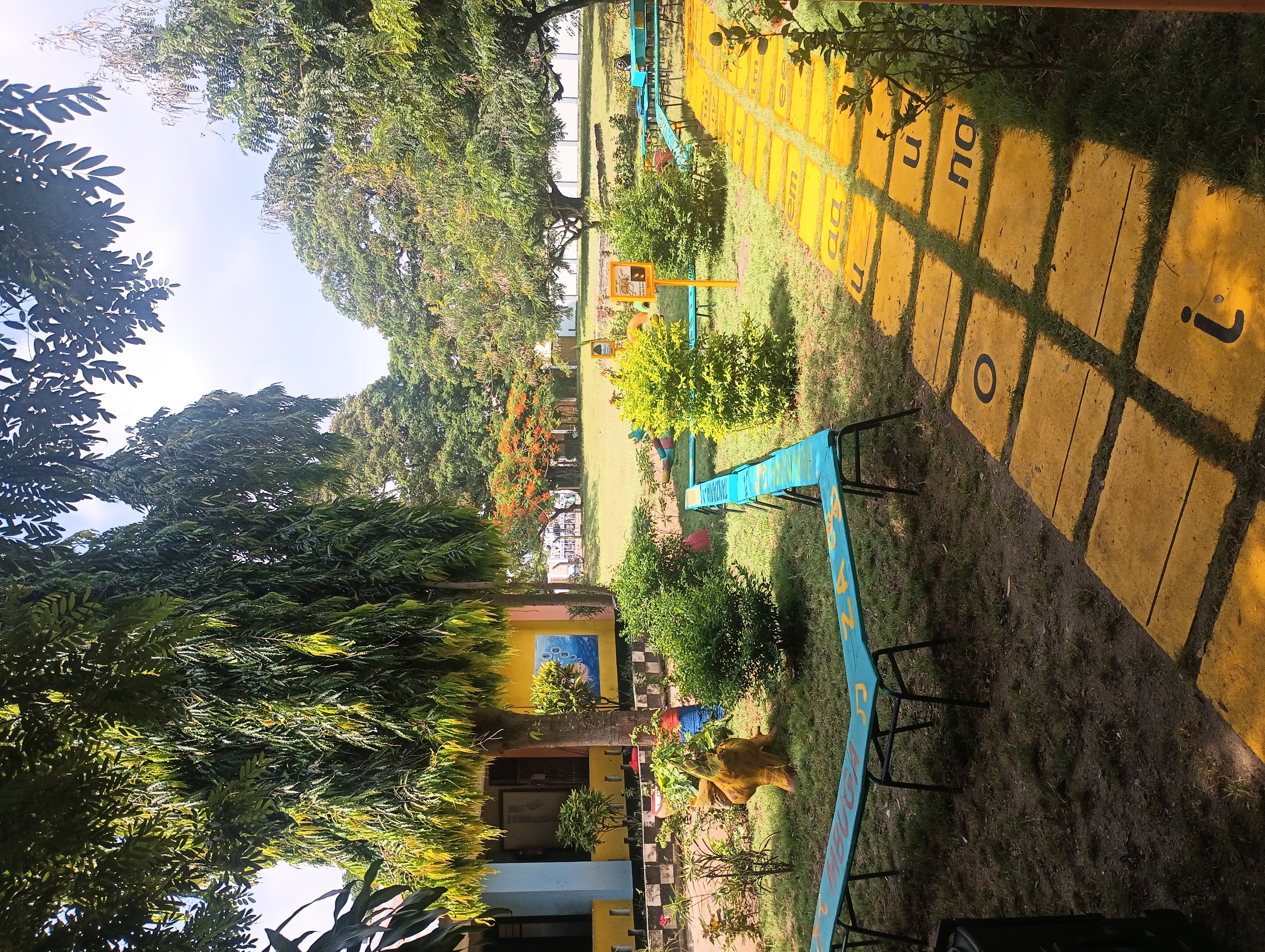 Close-up of wooden boards, painted blue and nailed together in a snake-like pattern. 