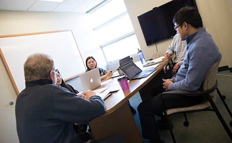 cepse leaders in a conference room discussing topics