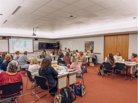 classroom full of teachers listening to a lecture