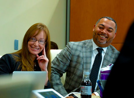 k12 folks listening and smiling to a conversation