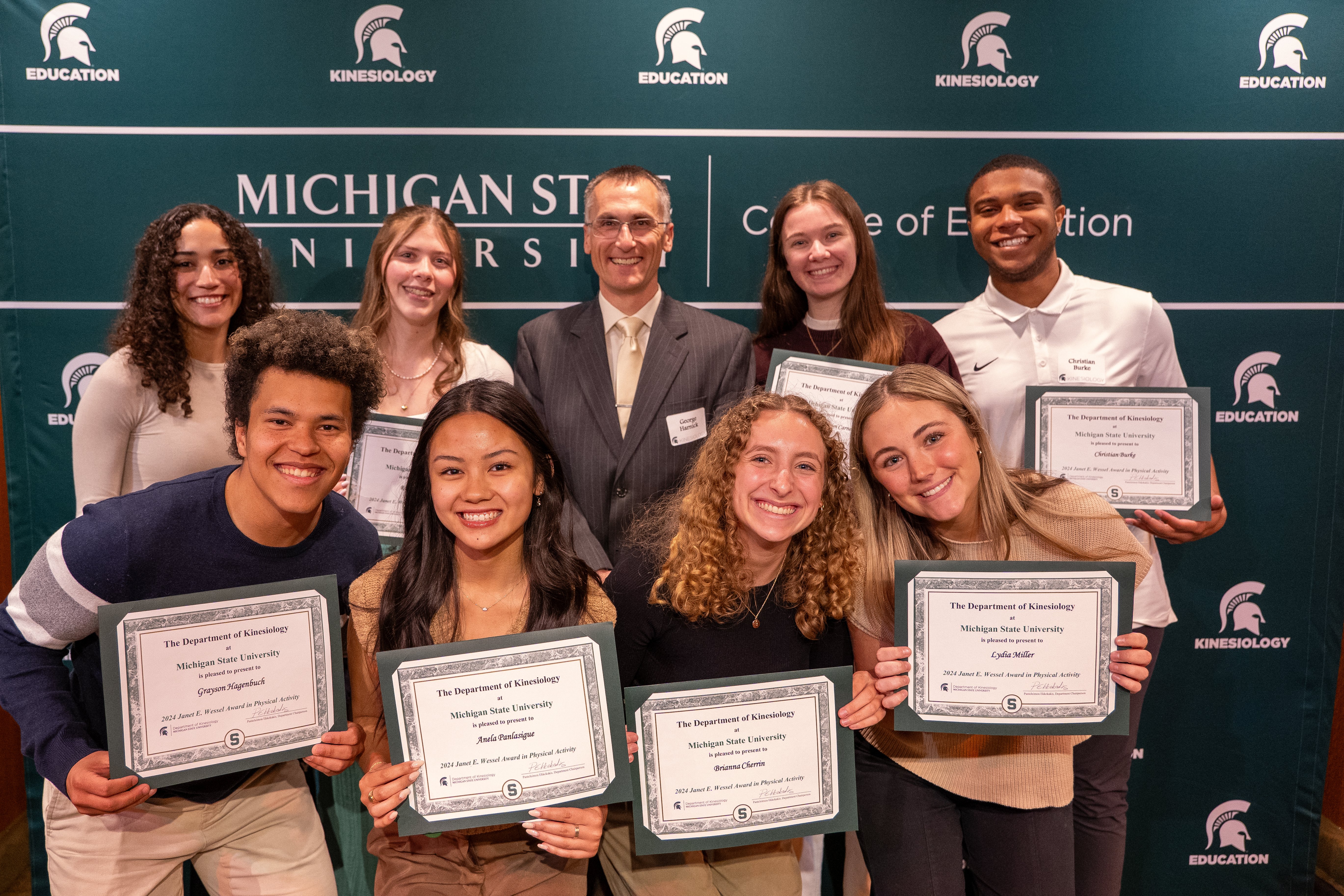 Group of Spartans smiles for a photo