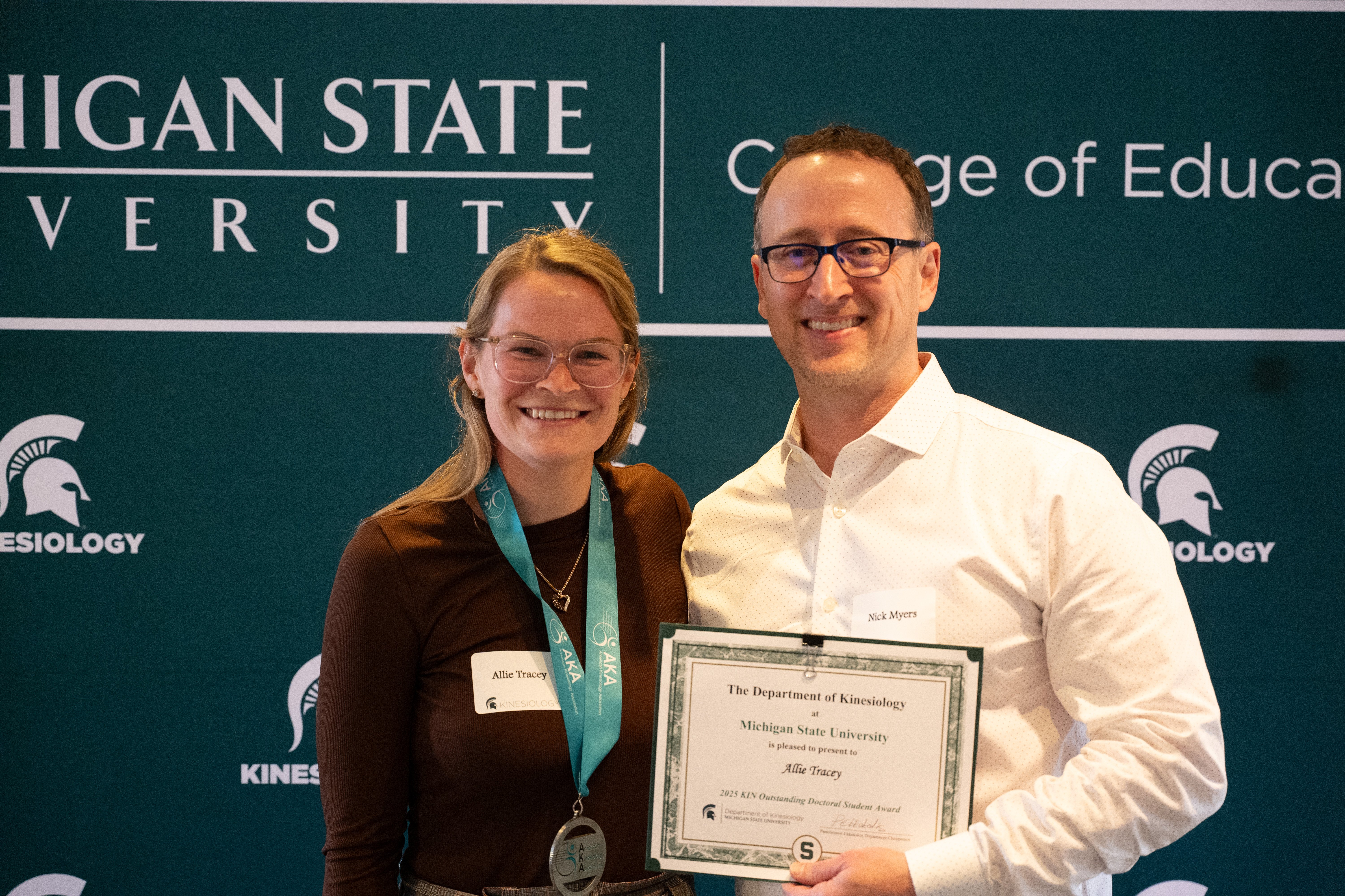 Spartans smile for a photo (from L to R: Allie Tracey and Professor Nick Myers)