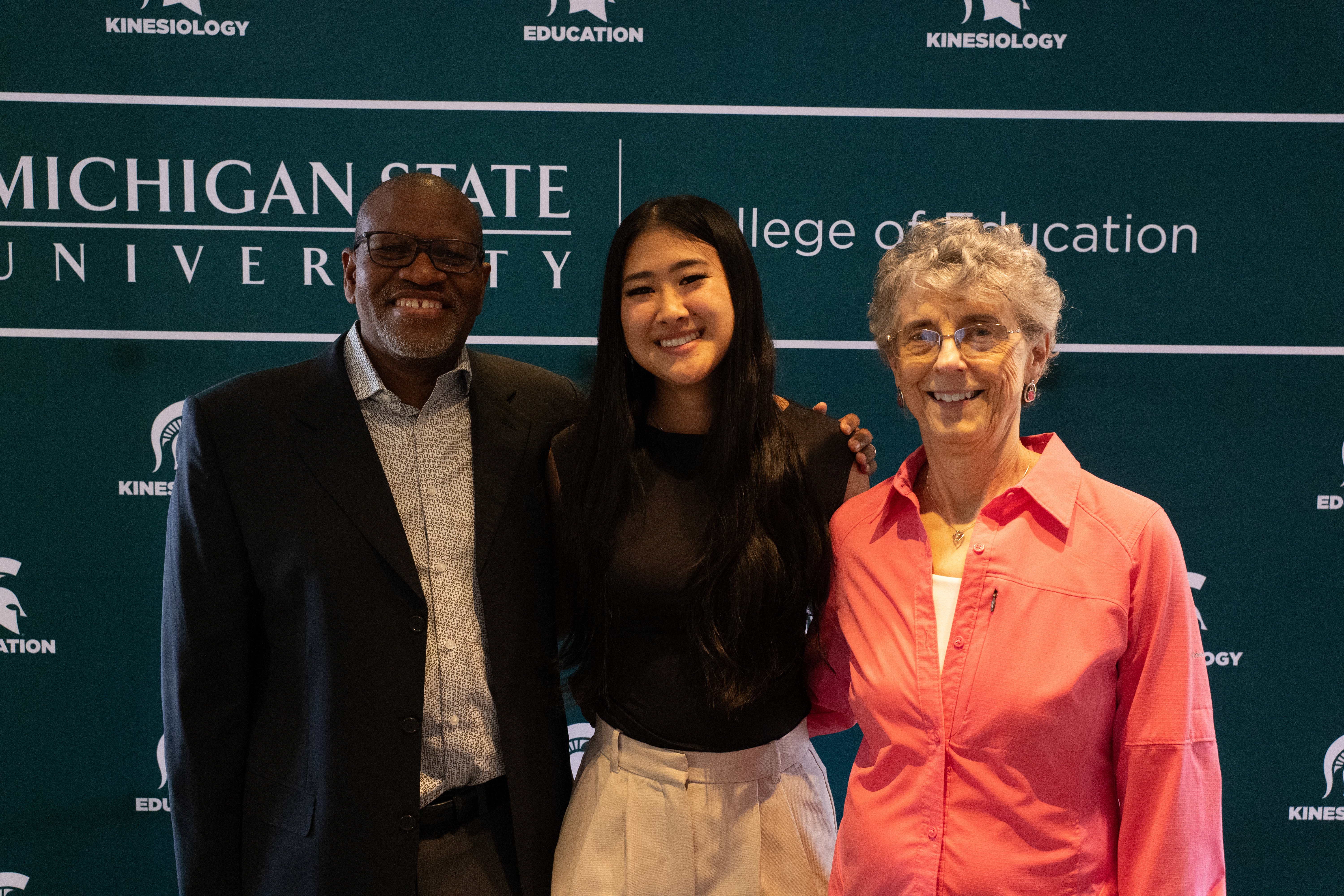 Spartans smile for a photo (from left to right: Leapetswe Malete, a student and Professor Emerita Deb Feltz)