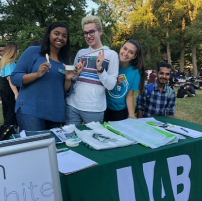 Students in a free gift table for UAB