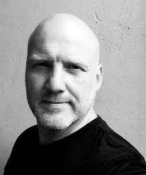 Black and white photo of Pelle Kvalsund; shoulders, neck and head shot.