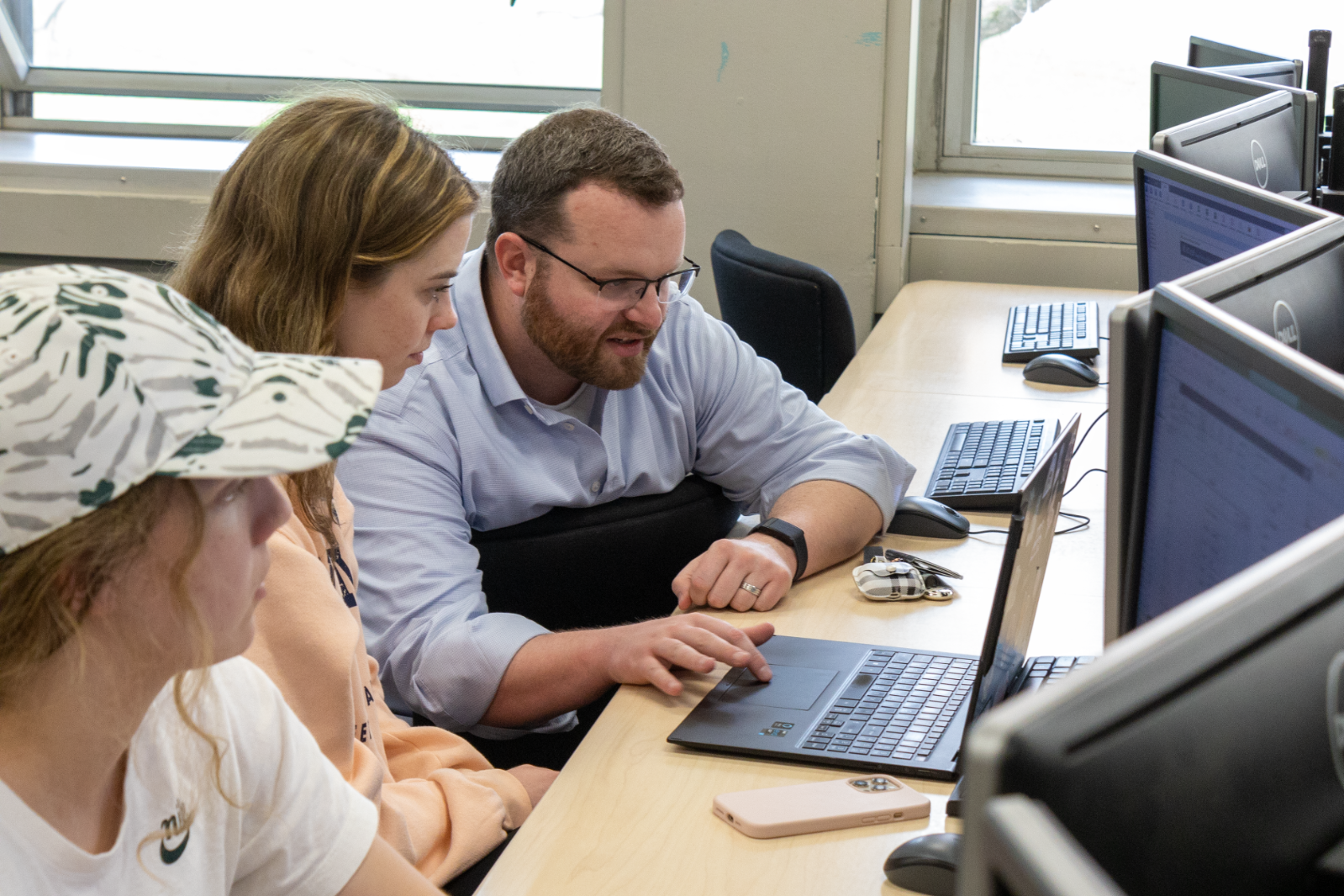Person instructing students in a computer lab