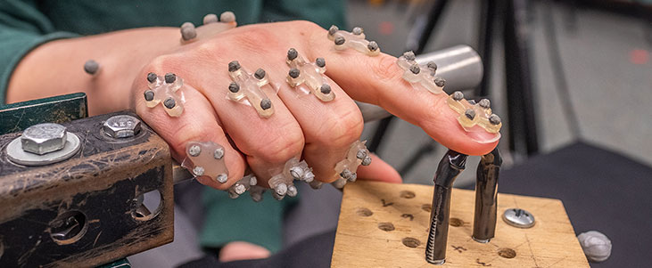 Close up of a hand with sensor points on it