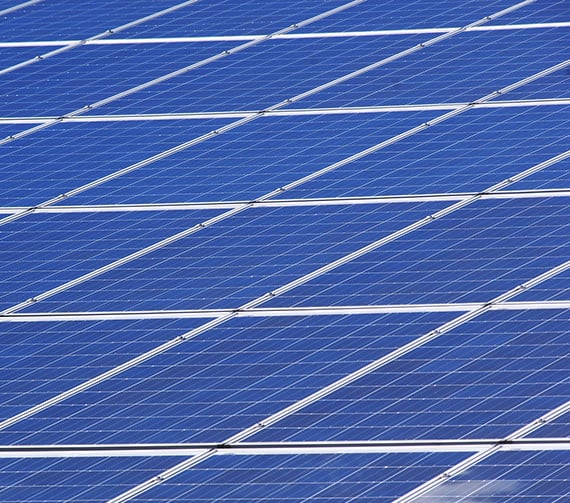 a close up of solar panels huddled around each other facing up to catch sun light