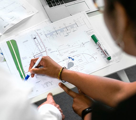 Close up of a people working on a chart plan for a DAM