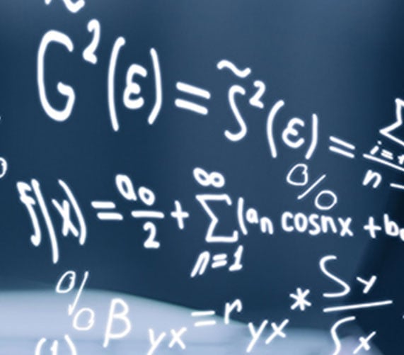Close up of equations on a glossy chalk board