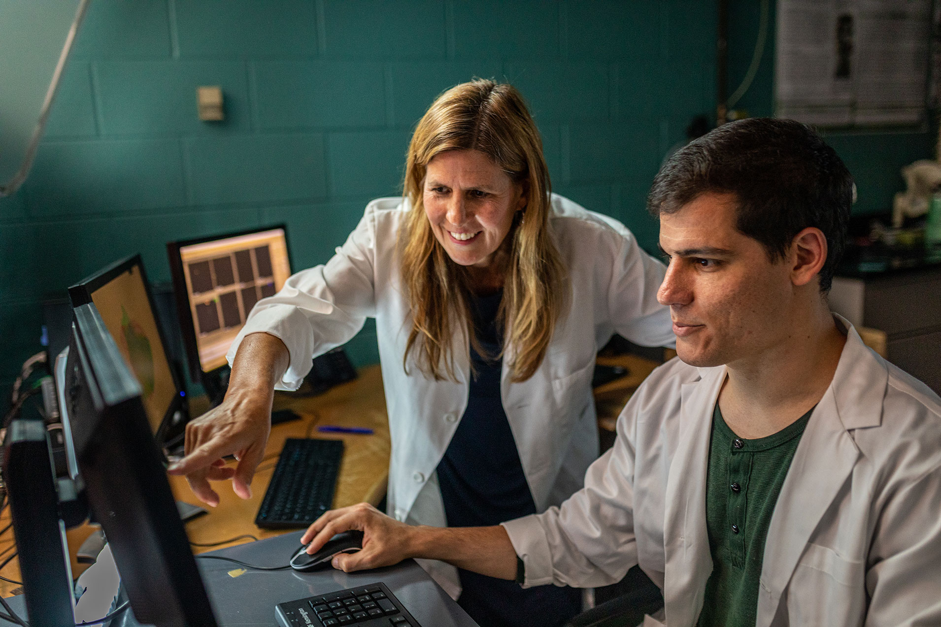 Doctor Tamara Reid Bush with a MSU student looking at a computer screen