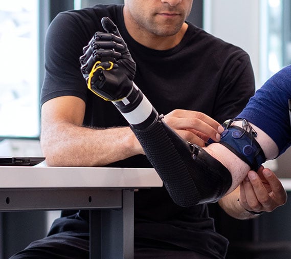 Student working on a mechanical arm