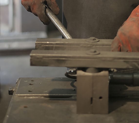 Hands working on a welding project