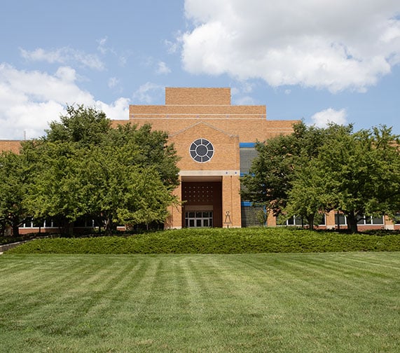 landscape view of the back of the engineering building on a cloudy sunny day