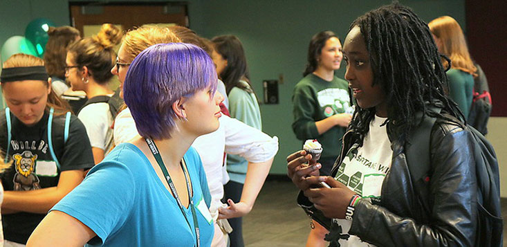 to WIE student ambassadors talking during the wie celebration