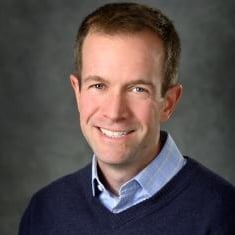 Professional headshot of Adam Alessio