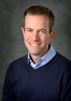 Professional headshot of Adam Alessio