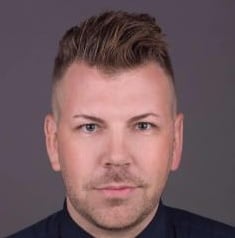 Professional headshot of Alex Delavan