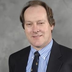 Professional headshot of Giles Brereton