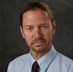 Professional headshot of Bradley Claark