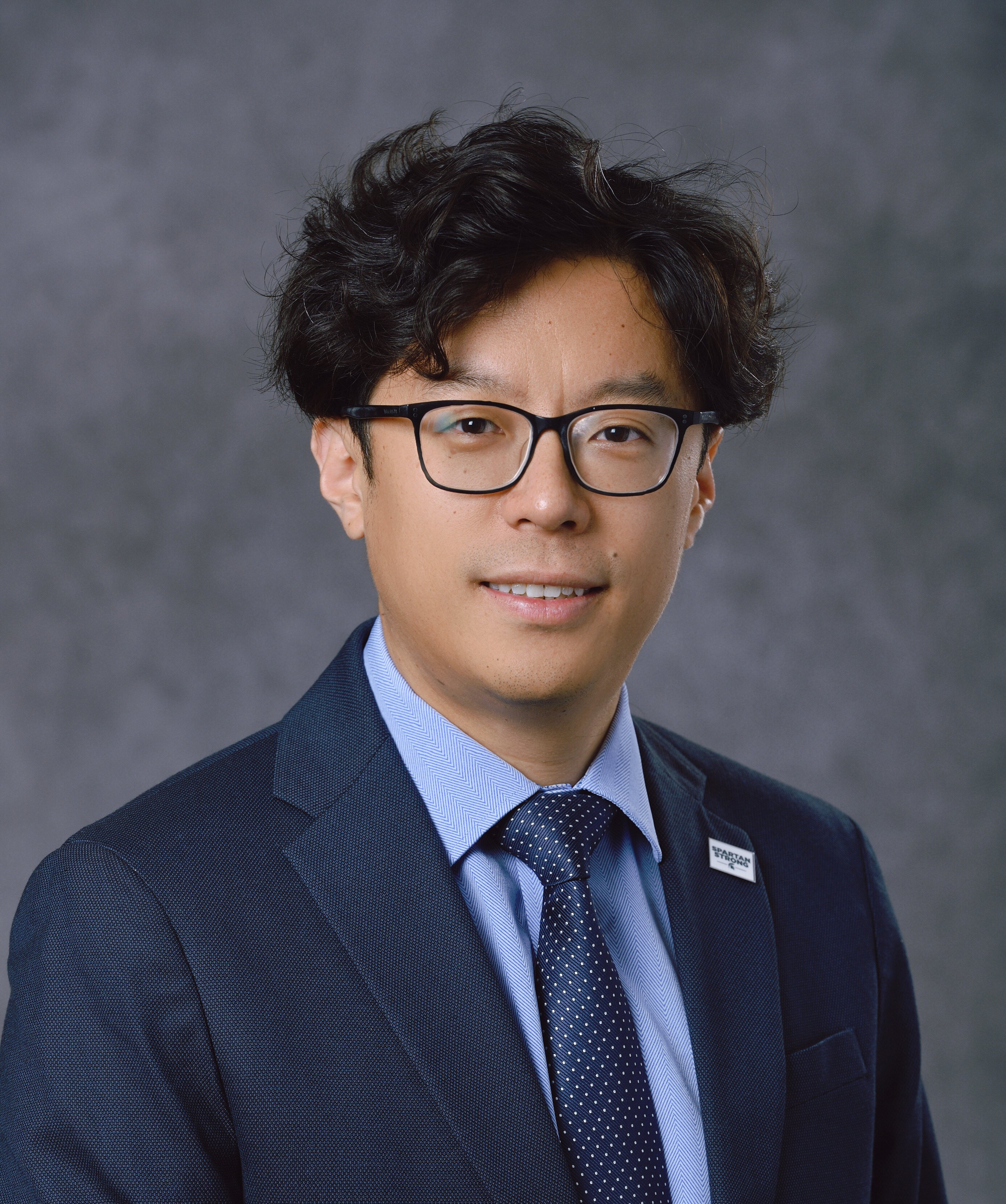 Professional headshot of Yiming Deng