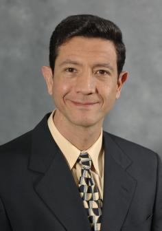 Professional headshot of Luis Donado