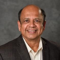 Professional headshot of K Jayaraman